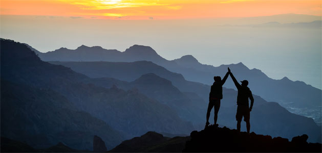 image of team reaching summit